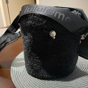 Lululemon black fleece crossbody drawstring black bag.